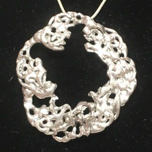 Round Circle Pendant with Holes necklace by Joanne Cooper and created in 1980's